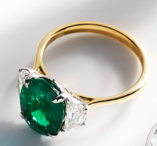 Gold ring with green gem