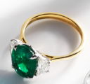 Gold ring with green gem